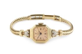 A lady's diamond set bracelet watch, the octagonal dial with Roman numeral quarters and baton