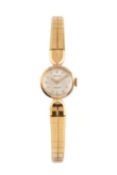 A lady's 9ct gold 'Precision' bracelet watch by Rolex, the circular silvered dial with gilt baton