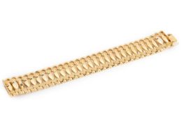 A yellow precious metal fancy-link bracelet, of hollow part-textured design, stamped '750', length