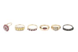 A collection of dress rings, comprising a diamond cluster ring, 9ct gold mounted, a ruby and diamond
