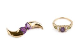 An amethyst, half pearl and peridot dress ring, with scroll decorated gallery and shoulders, 9ct