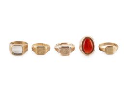 Three 9ct gold signet rings, each with a monogrammed rectangular panel, together with a carnelian