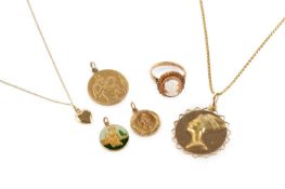 A collection of jewellery, comprising an Egyptian pendant on a fancy-link chain, stamped '750', a