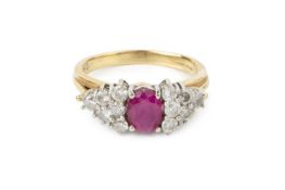 A ruby and diamond cluster ring, the oval mixed-cut ruby claw set between triangular clusters of