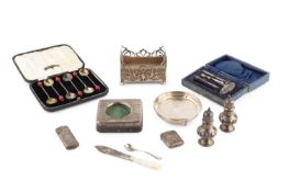 A collection of silver, to include an Edwardian pierce decorated rectangular card box, with wooden