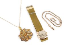 A stone set pendant on chain, the oval mixed-cut orange stone in foiled closed-back setting,