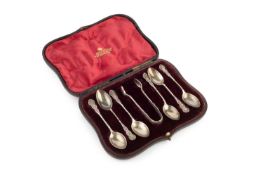 A set of six late Victorian silver teaspoons, with matching sugar tongs, having twist and foliate