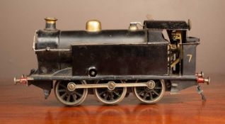 A clockwork, possibly continental, 0 gauge tin plate 0-6-0 tank locomotive