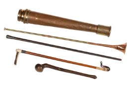 A copper fire hose nozzle, and various sticks
