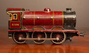 A tin plate continental 0 gauge 0-6-0 clockwork locomotive