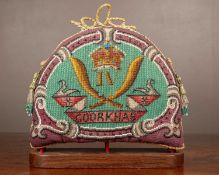 An old beadwork tea cosy of military interest