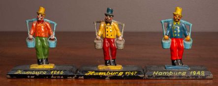 Three painted cast iron figures of gentlemen