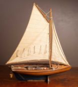 A wooden model yacht