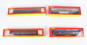 Four Hornby OO gauge coaches.
