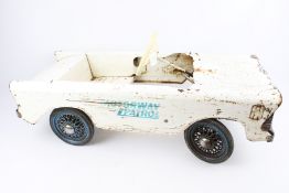 A Tri-ang Motorway Patrol pedal car.