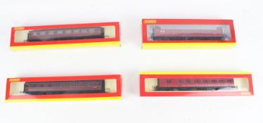 Four Hornby OO gauge coaches.