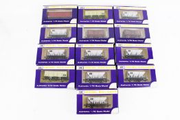 Thirteen Dapol OO gauge wagons.