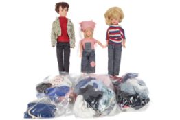 Two 1960s Cindy dolls, a Paul doll and accessories. Including uniforms, dresses, a stand, etc.