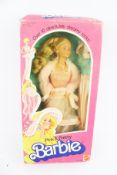 A Mattel 'Pink & Pretty' Barbie doll.