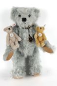 A collection of three teddy bears.