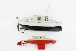 Two Sutcliffe tinplate Sutcliffe boats.
