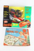 A Merit Remote Control Driving Test and a Tonka 'Tirestorm' remote control car.
