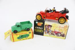 Two diecast model vehicles.