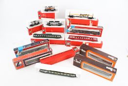 Twelve Lima OO gauge coaches and wagons.
