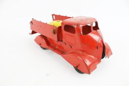 A 1950s Tri-ang tipper truck with yellow bell.