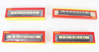 Four Hornby OO gauge coaches.