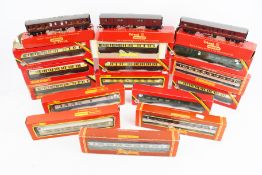 Sixteen Hornby OO gauge coaches.