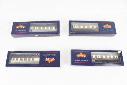 Four Bachmann OO gauge coaches.
