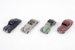 Four Dinky cars.
