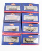 Eight OO gauge wagons.
