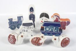 Nine Carlton Ware ceramic money boxes.