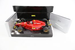 A TFBB (Toys for Big Boys) remote control Porsche and an Onyx Formula 1 model.