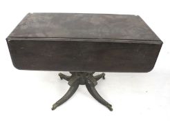 An early 20th century drop leaf mahogany table.