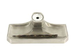 An early 20th century cast metal desk inkwell with pen tray. With pen and ceramic liner. 25.