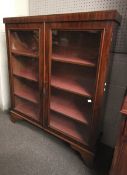 A 20th century mahogany display cabinet.
