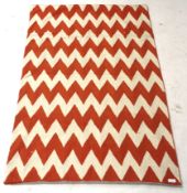 Zaida Kashmir wool textile throw orange and white zig zag.