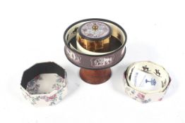 A vintage zoopraxiscope. Mounted on a wooden stand, including reels of animals, horse races, etc.