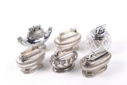 Six Ronson table lighters. Of various designs, including silver plated and glass examples. Max. H6.