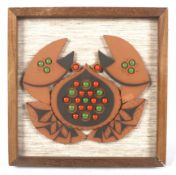 A Hornsea Muramic handcrafted wall plaque.