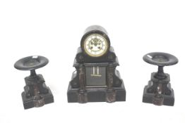 A Victorian black slate and marble clock garniture.
