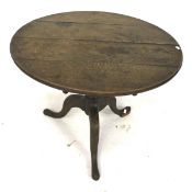 An oak tripod occasional table.