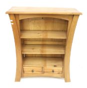 A contemporary freestanding bookcase.