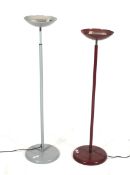 Two retro patio heaters with adjustable telescopic stands.