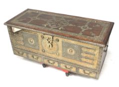 A contemporary Indian brass bound and studded trunk.