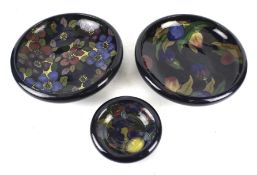 Three assorted Jacobean ware dishes. Each decorated with flower and fruit, Max.