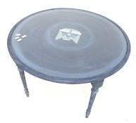 A circular wooden coffee table.